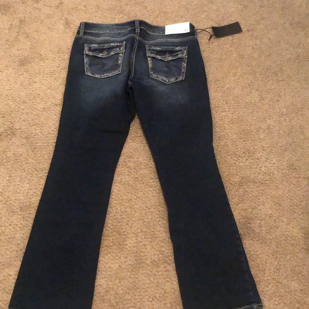 Mid rise dark wash suki silver jeans